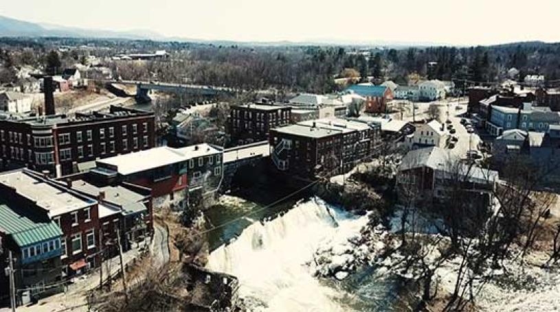 Aerial view of downtown Middlebury and the waterfall in the winter