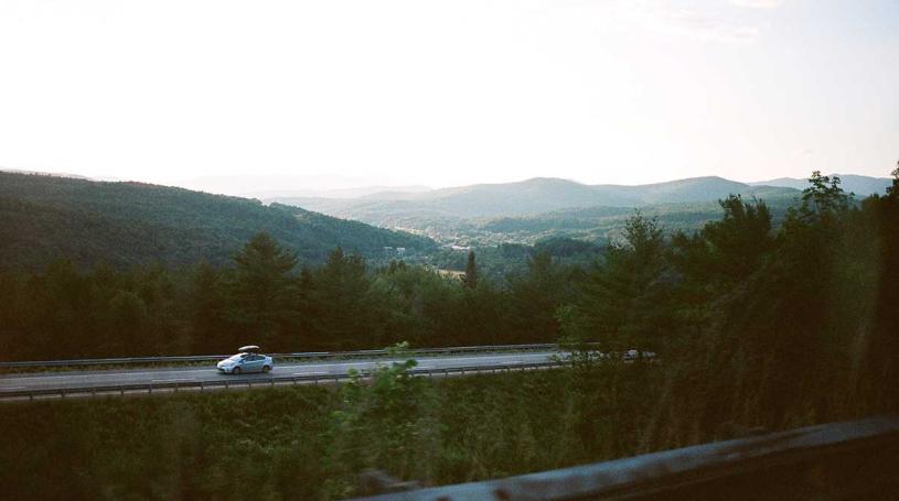 An electric car driving on a Vermont highway