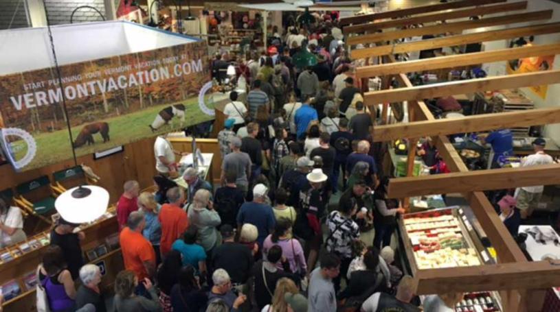 A photo of the crowd in the Vermont Building a the Big E fair, seen from above